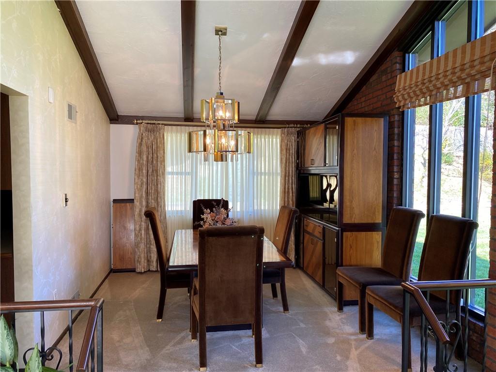 7919 Mt Carmel Road Verona, PA 15147 - Photo 9 of 38 a view of a dining room with furniture window and wooden floor