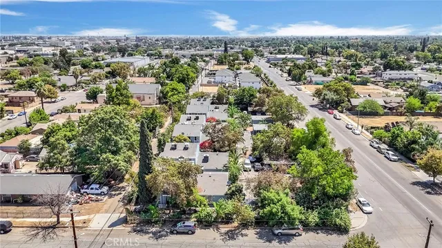 an aerial view of residential houses with city view