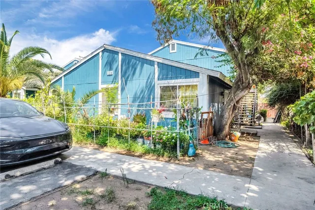 a view of a car park in front of a house