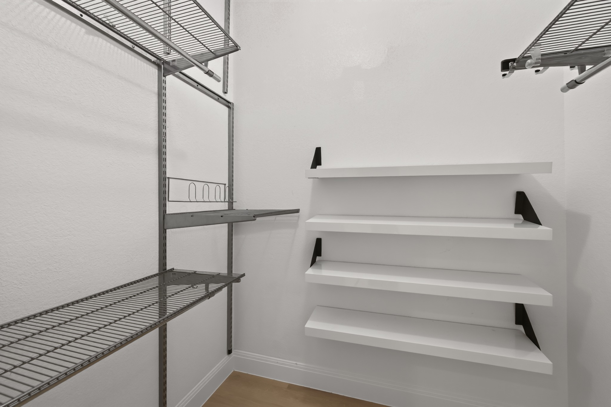 13536 Anarosa Loop Austin, TX 78727 - Photo 23 of 31 Generous wall-to-wall hanging racks and overhead shelving make organizing wardrobe collections simple and stress-free