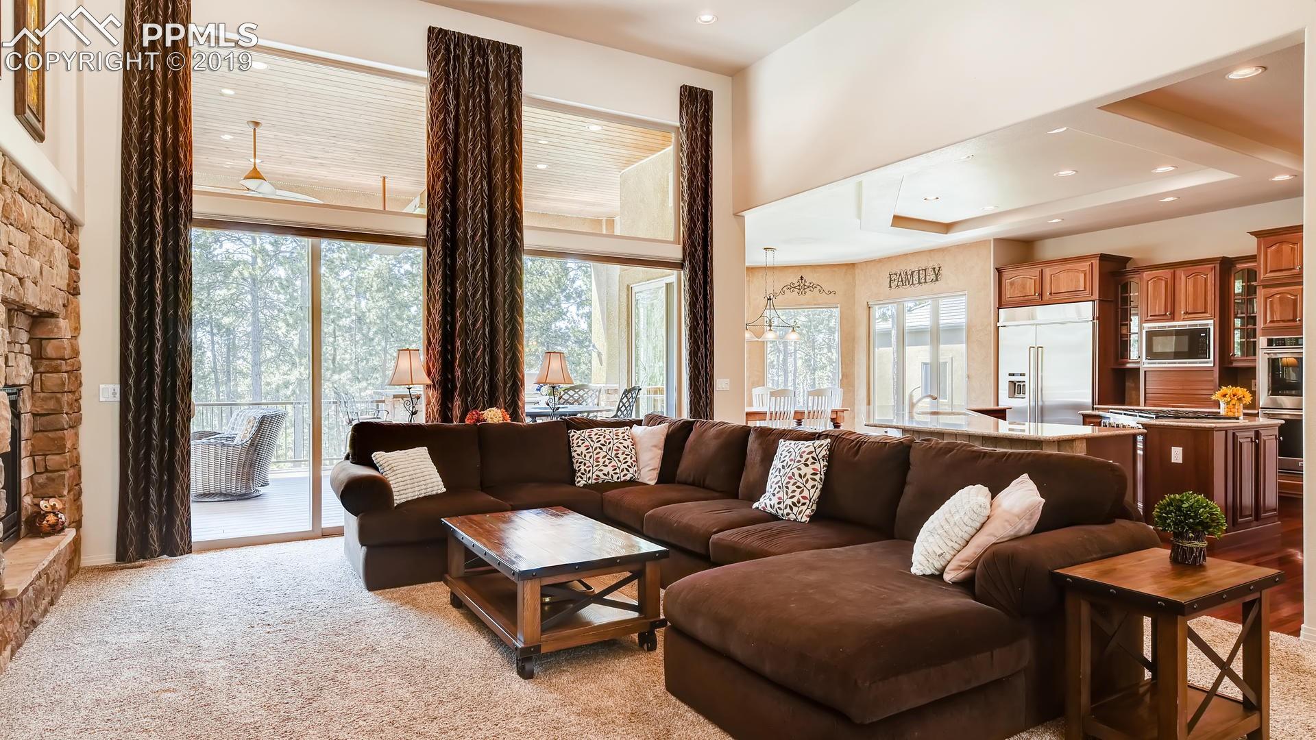 4061 High Forest Road Colorado Springs, CO 80908 - Photo 8 of 40 ...floor to ceiling windows. Custom window treatments included.