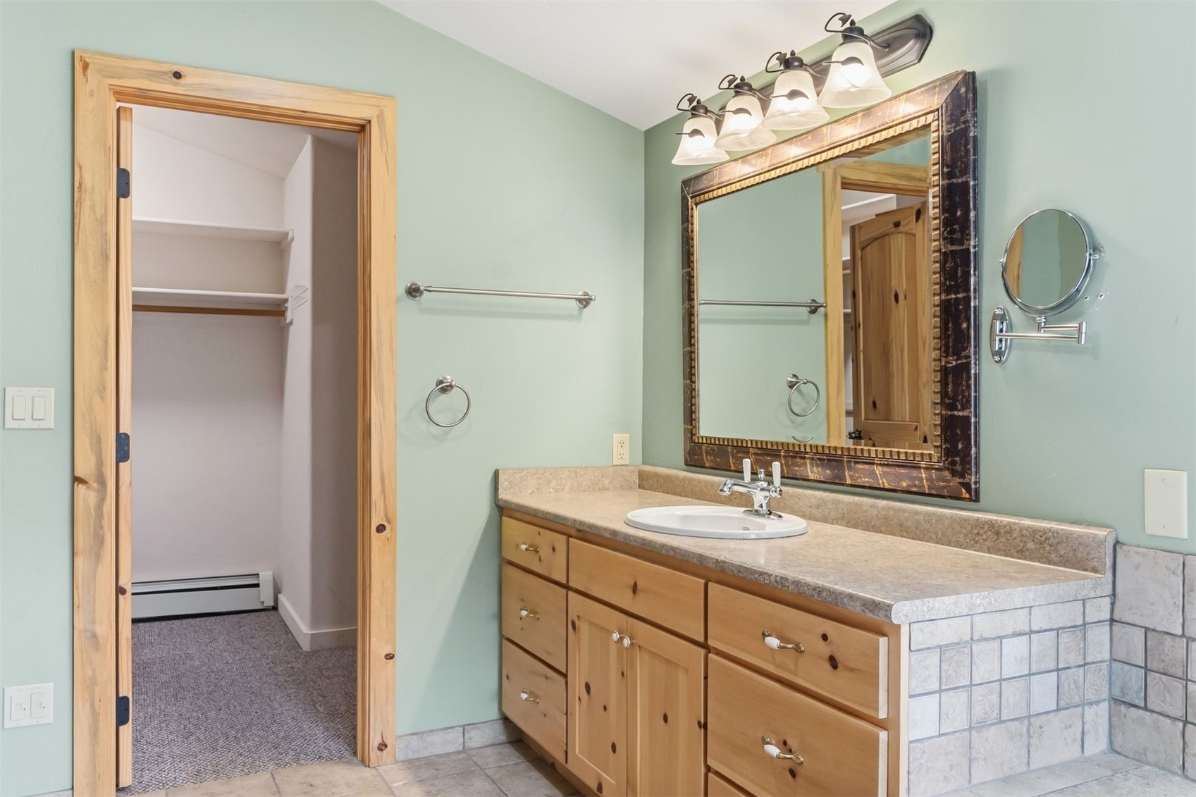 515 Pitkin Street Frisco, CO 80443 - Photo 37 of 50 a bathroom with a sink vanity and a mirror