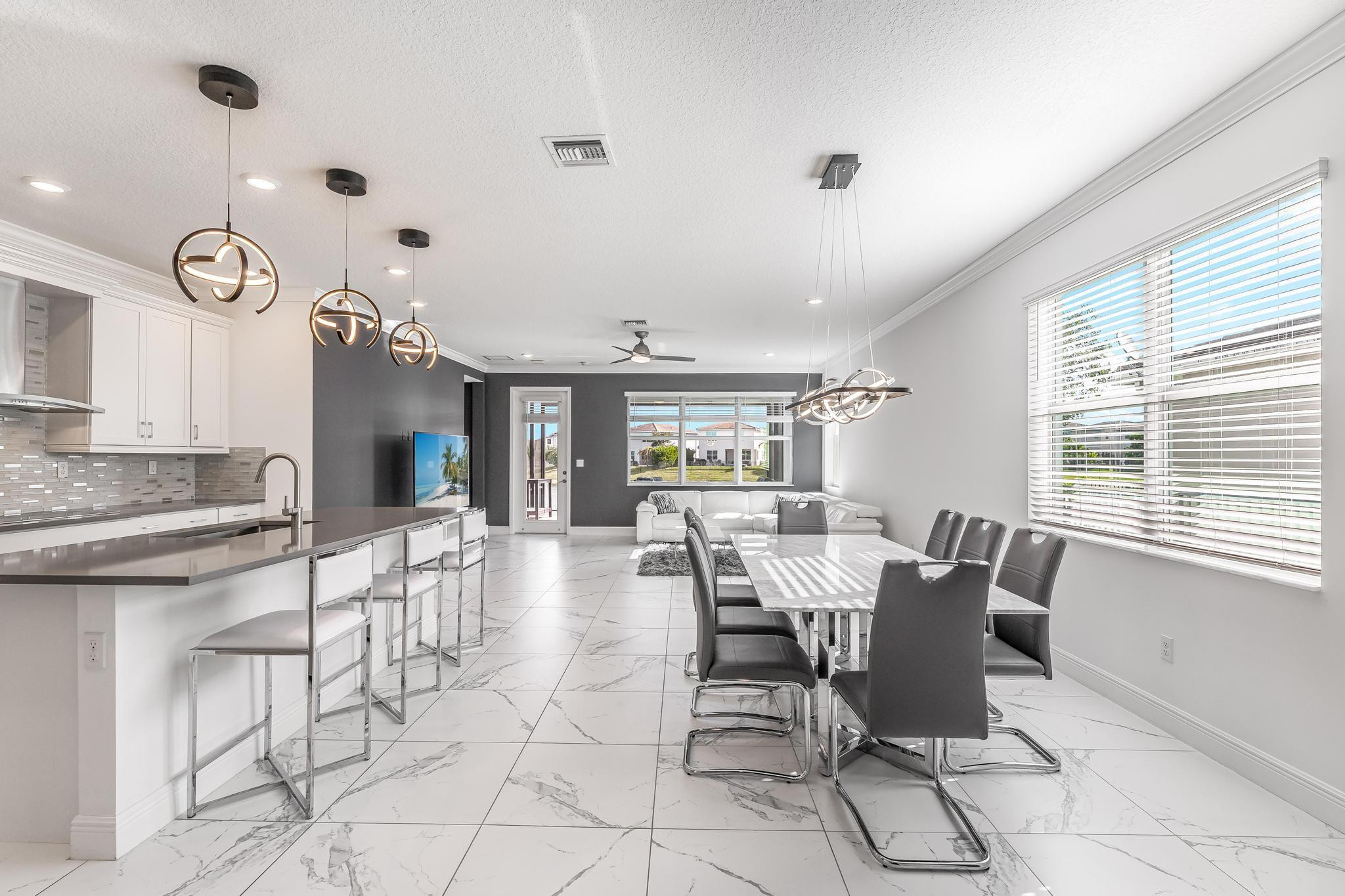 4164 Rosa Drive Deerfield Beach, FL 33064 - Photo 15 of 50 a view of a dining room with furniture and window