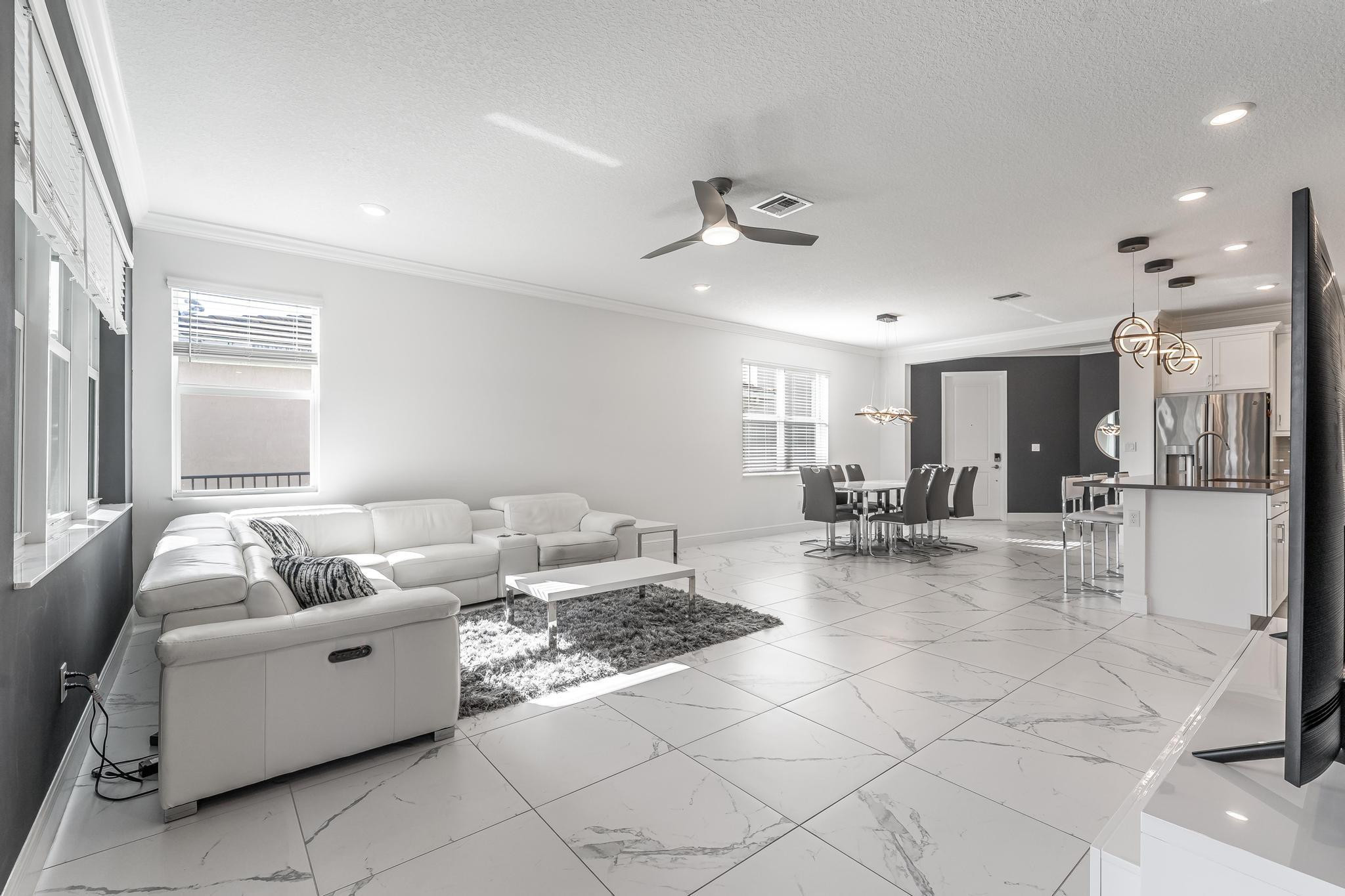 4164 Rosa Drive Deerfield Beach, FL 33064 - Photo 21 of 50 a living room with furniture and a table