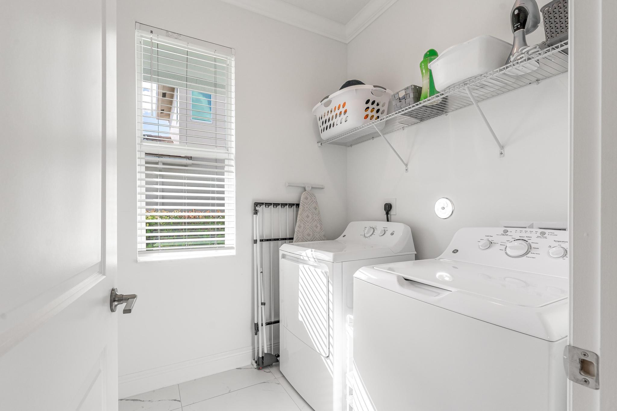 4164 Rosa Drive Deerfield Beach, FL 33064 - Photo 25 of 50 a view of a storage and utility room with a window