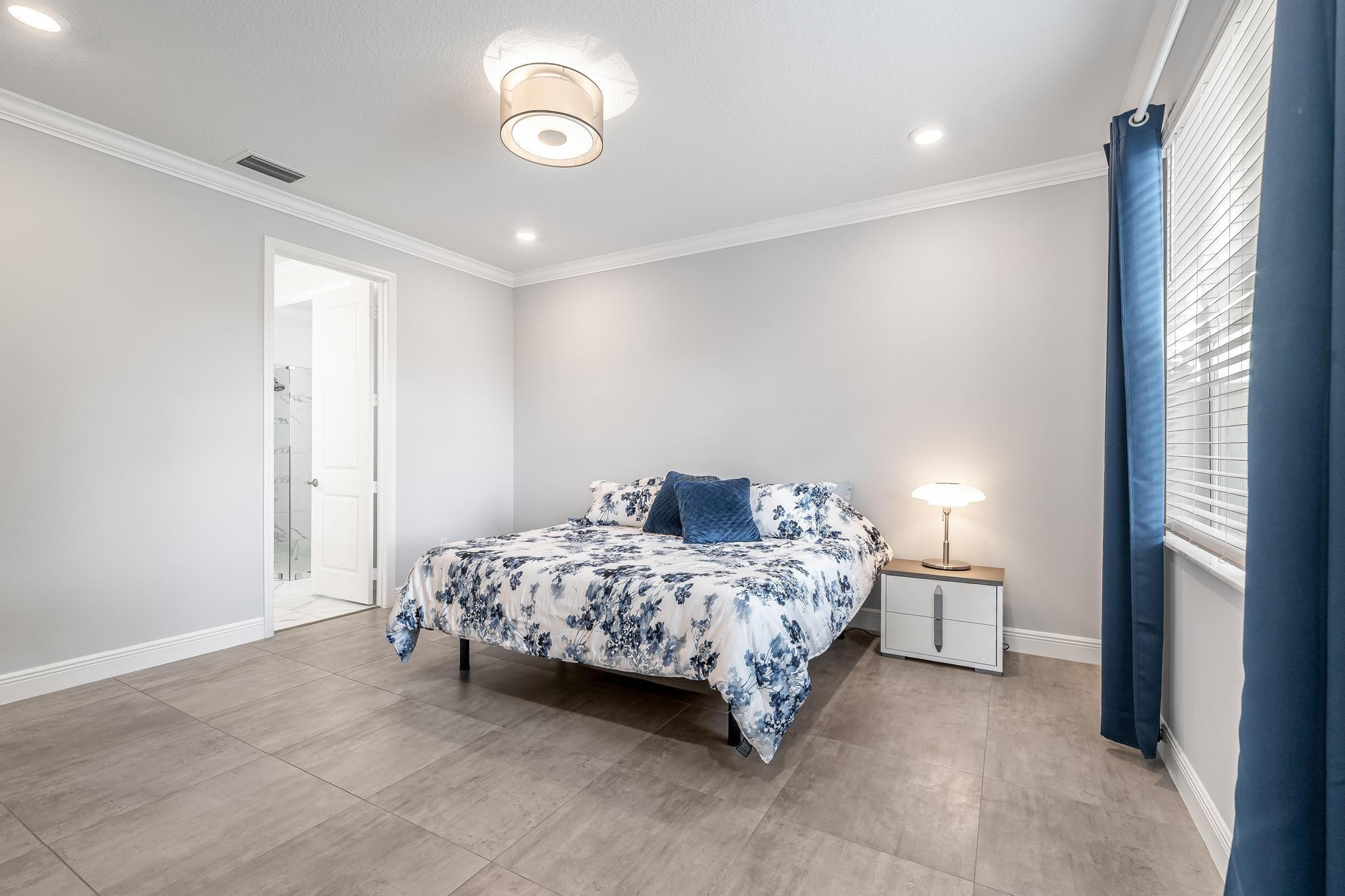 4164 Rosa Drive Deerfield Beach, FL 33064 - Photo 29 of 50 a bedroom with a bed and a window
