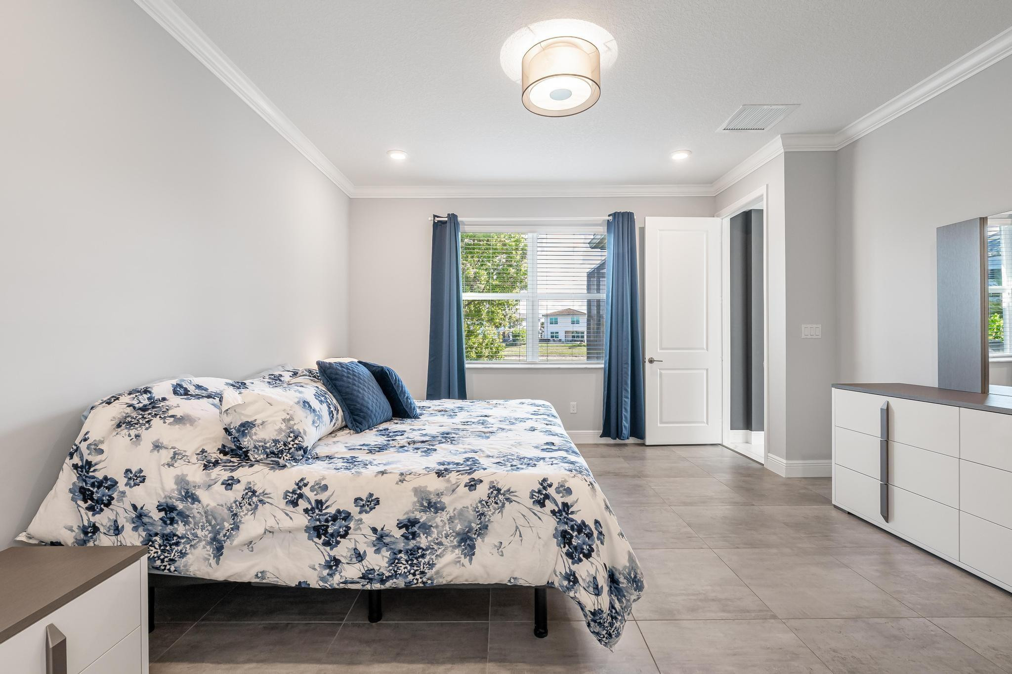 4164 Rosa Drive Deerfield Beach, FL 33064 - Photo 30 of 50 a bedroom with a large bed and a window