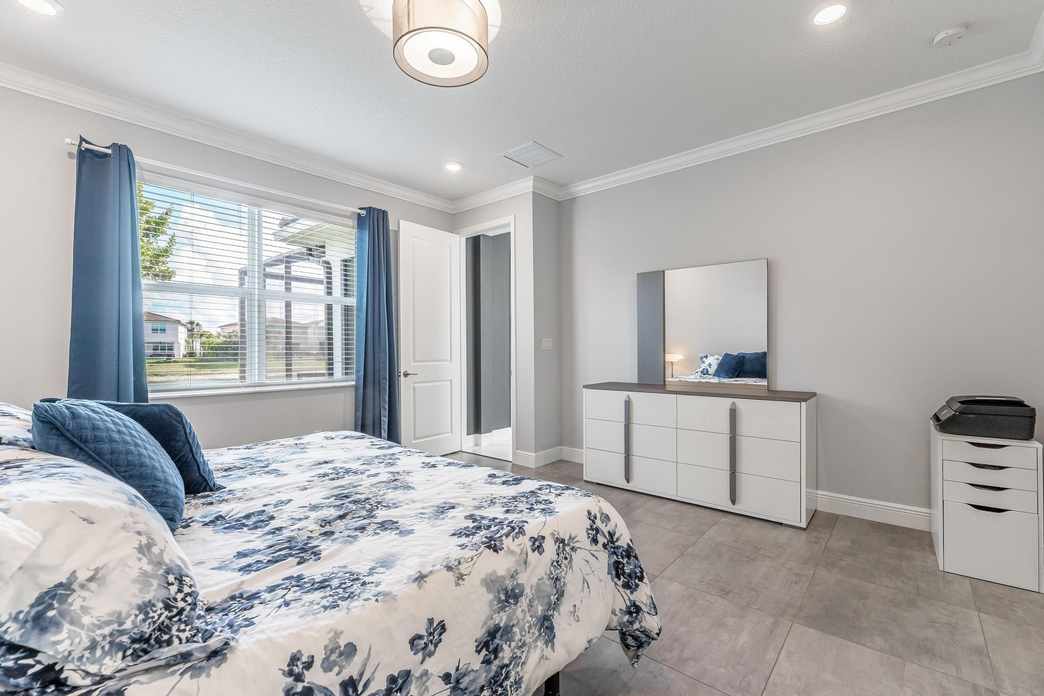4164 Rosa Drive Deerfield Beach, FL 33064 - Photo 31 of 50 a bedroom with a bed and a dresser