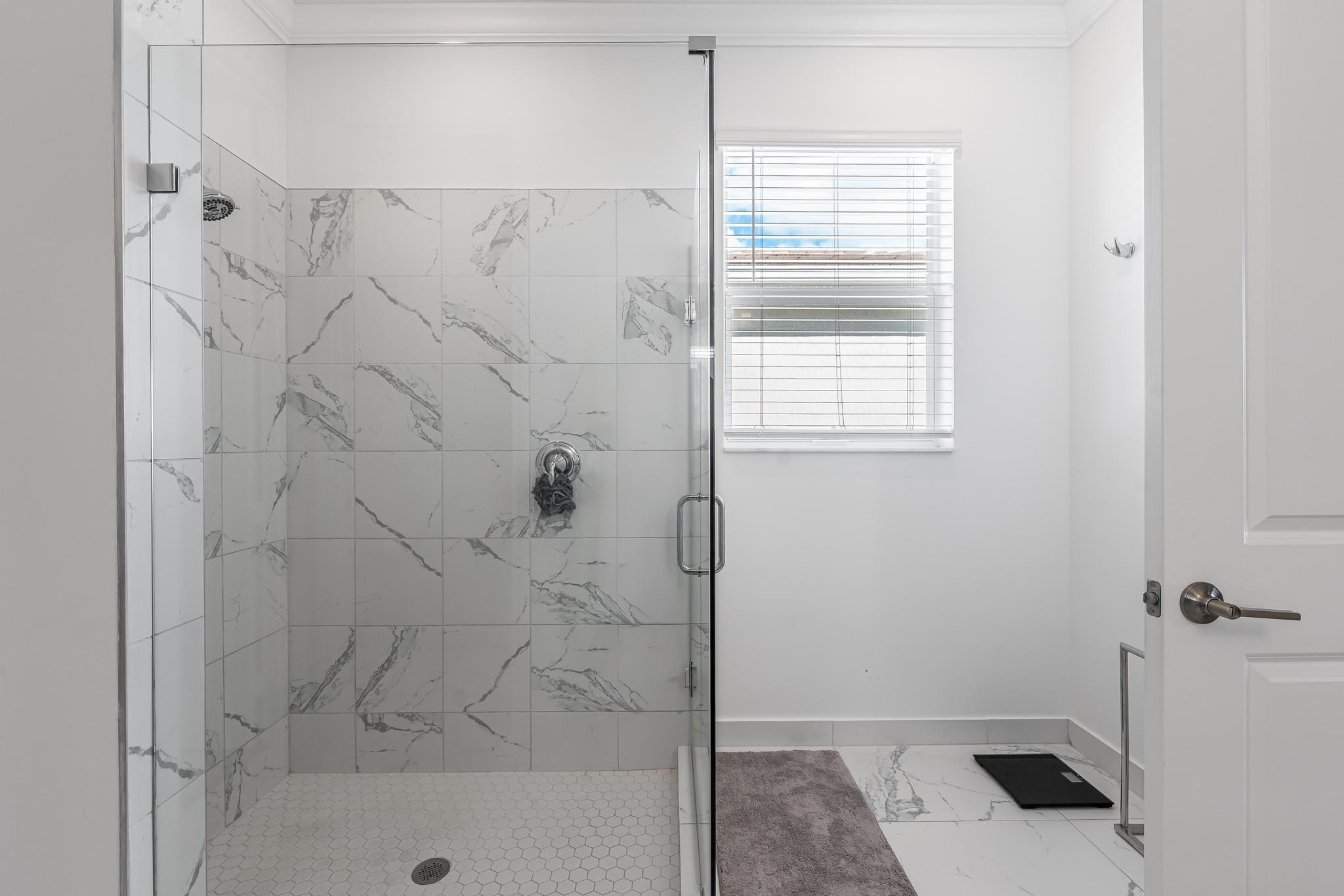 4164 Rosa Drive Deerfield Beach, FL 33064 - Photo 34 of 50 a bathroom with a bathtub and shower