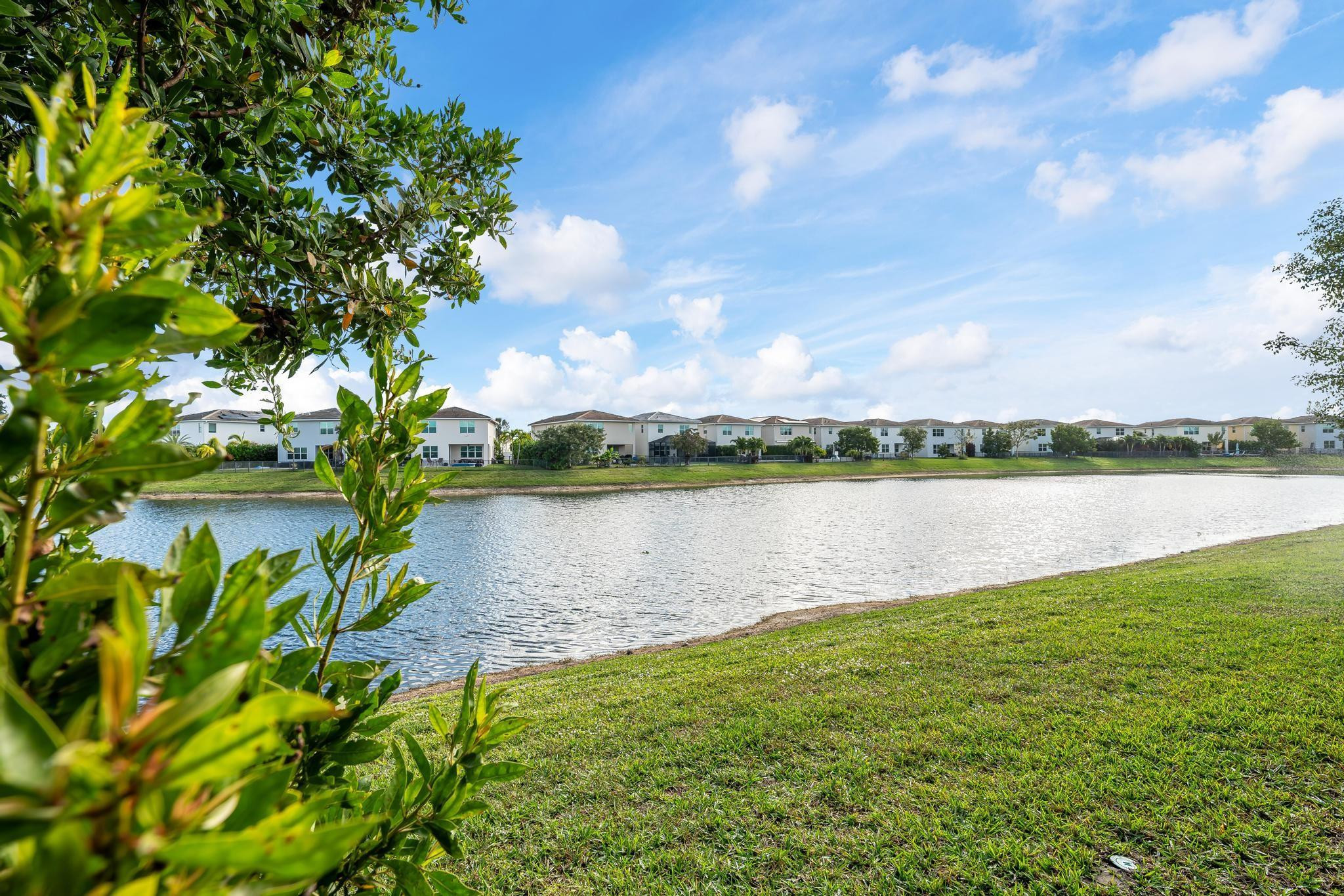 4164 Rosa Drive Deerfield Beach, FL 33064 - Photo 38 of 50 a view of a lake with a big yard