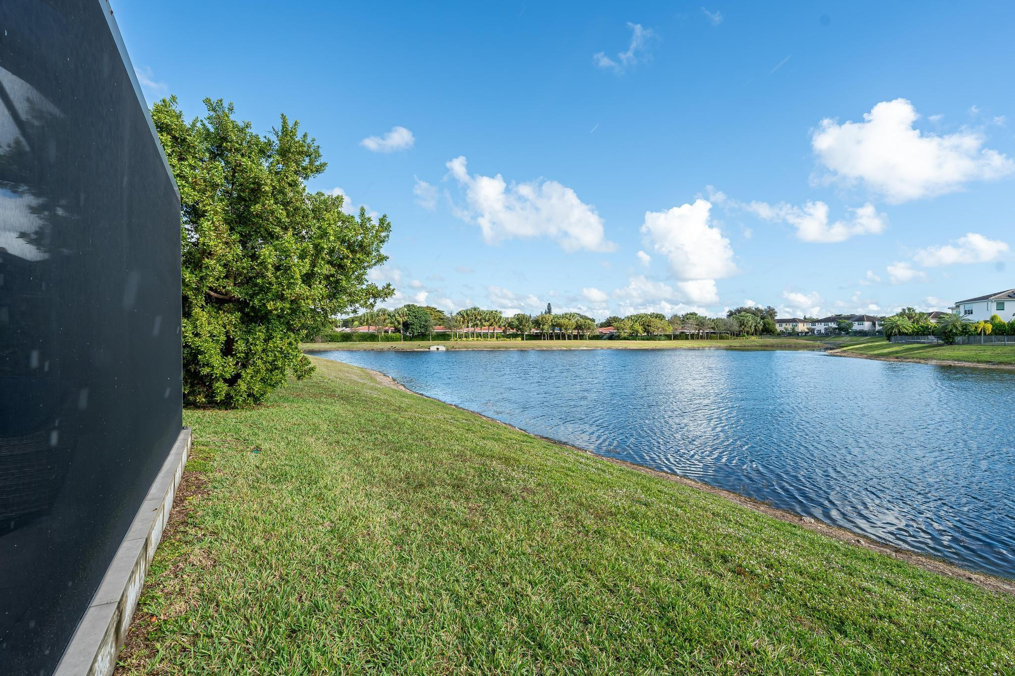4164 Rosa Drive Deerfield Beach, FL 33064 - Photo 39 of 50 a view of a lake with houses in the back