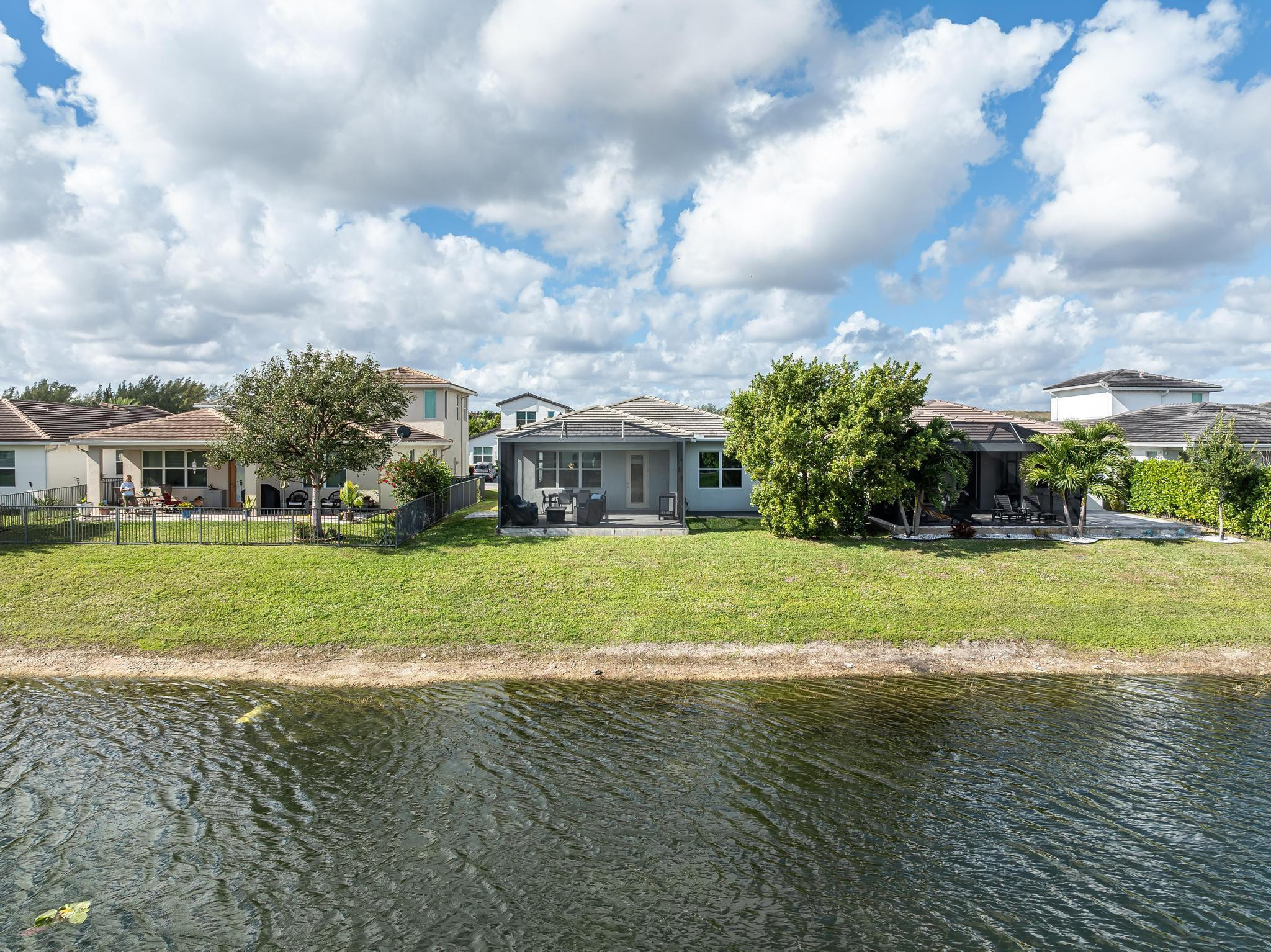 4164 Rosa Drive Deerfield Beach, FL 33064 - Photo 4 of 50 a front view of house with yard and entertaining space