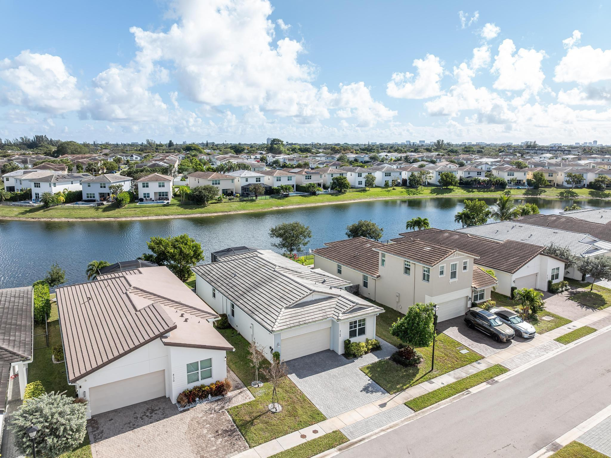 4164 Rosa Drive Deerfield Beach, FL 33064 - Photo 8 of 50 an aerial view of a house with outdoor space and lake view in back