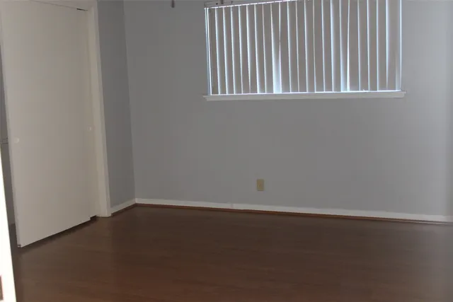 a bathroom with a sink toilet and a mirror