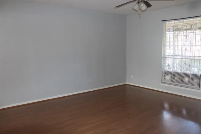 a white toilet sitting next to a shower