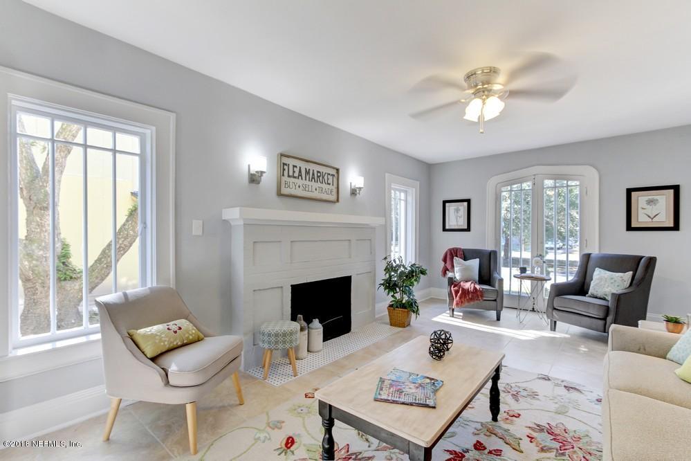 2241 Bayview Road Jacksonville, FL 32210 - Photo 18 of 55 a living room with furniture and a fireplace