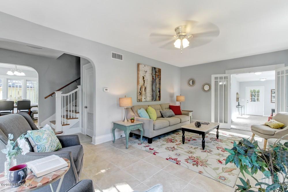 2241 Bayview Road Jacksonville, FL 32210 - Photo 19 of 55 a living room with furniture and a chandelier