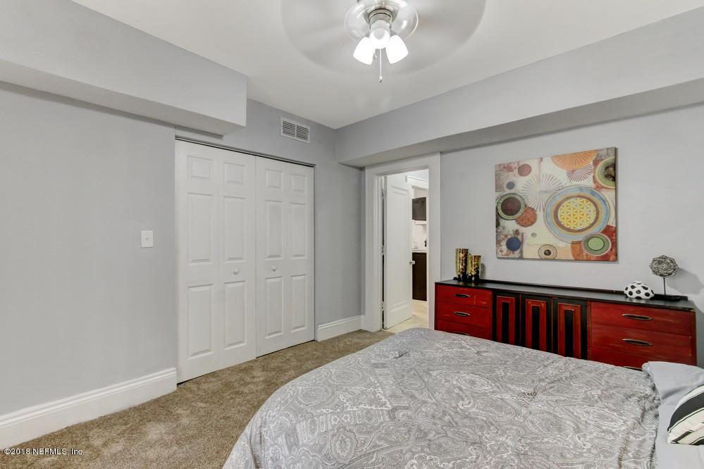 2241 Bayview Road Jacksonville, FL 32210 - Photo 23 of 55 a bedroom with a bed and dresser