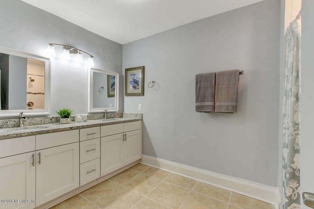 2241 Bayview Road Jacksonville, FL 32210 - Photo 25 of 55 a bathroom with 2 sink and a mirror