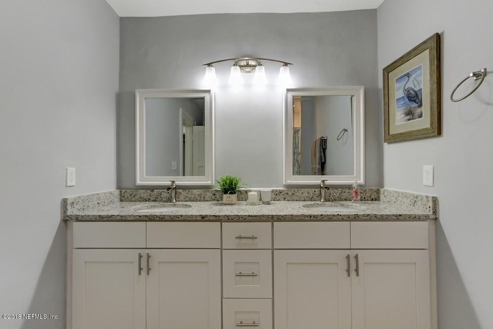 2241 Bayview Road Jacksonville, FL 32210 - Photo 26 of 55 a bathroom with a granite countertop sink and a mirror