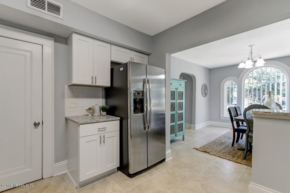 2241 Bayview Road Jacksonville, FL 32210 - Photo 32 of 55 a kitchen with stainless steel appliances granite countertop a refrigerator and a stove top oven