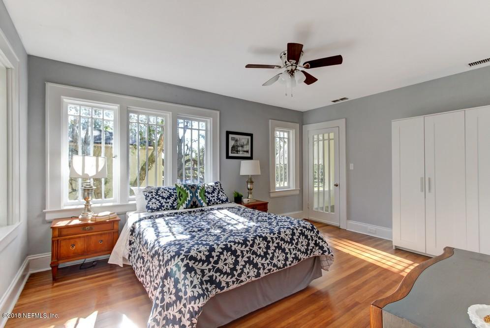2241 Bayview Road Jacksonville, FL 32210 - Photo 37 of 55 a bed sitting in a bedroom next to a window