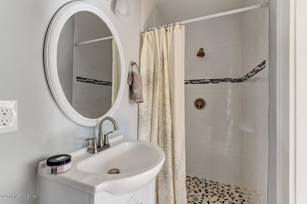 2241 Bayview Road Jacksonville, FL 32210 - Photo 41 of 55 a bathroom with a sink and a mirror