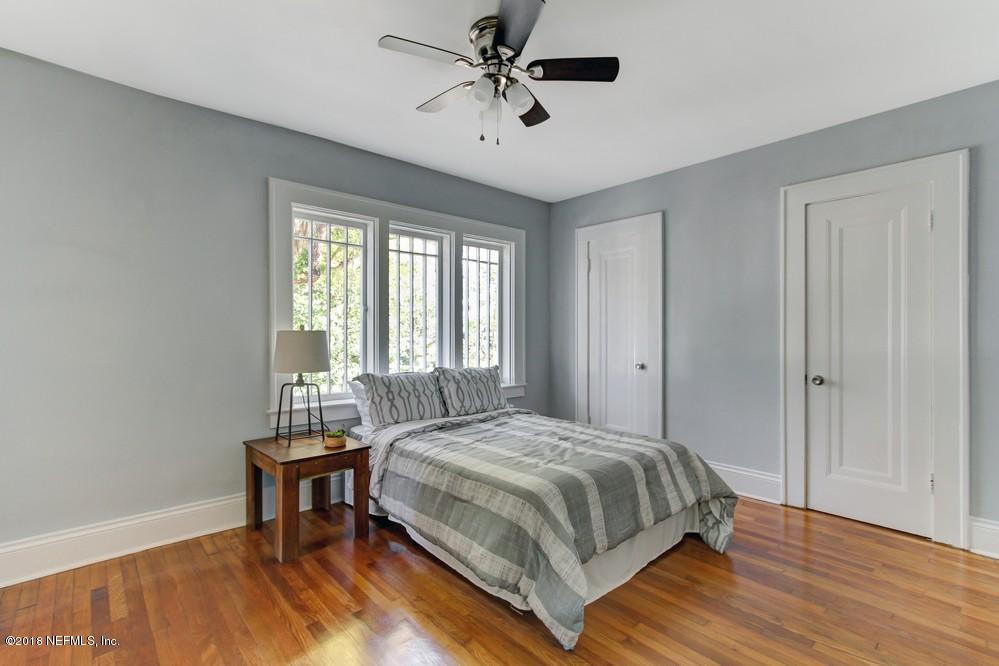 2241 Bayview Road Jacksonville, FL 32210 - Photo 42 of 55 a bedroom with a bed a table and chair