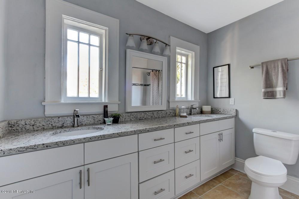 2241 Bayview Road Jacksonville, FL 32210 - Photo 46 of 55 a bathroom with a granite countertop toilet sink and mirror