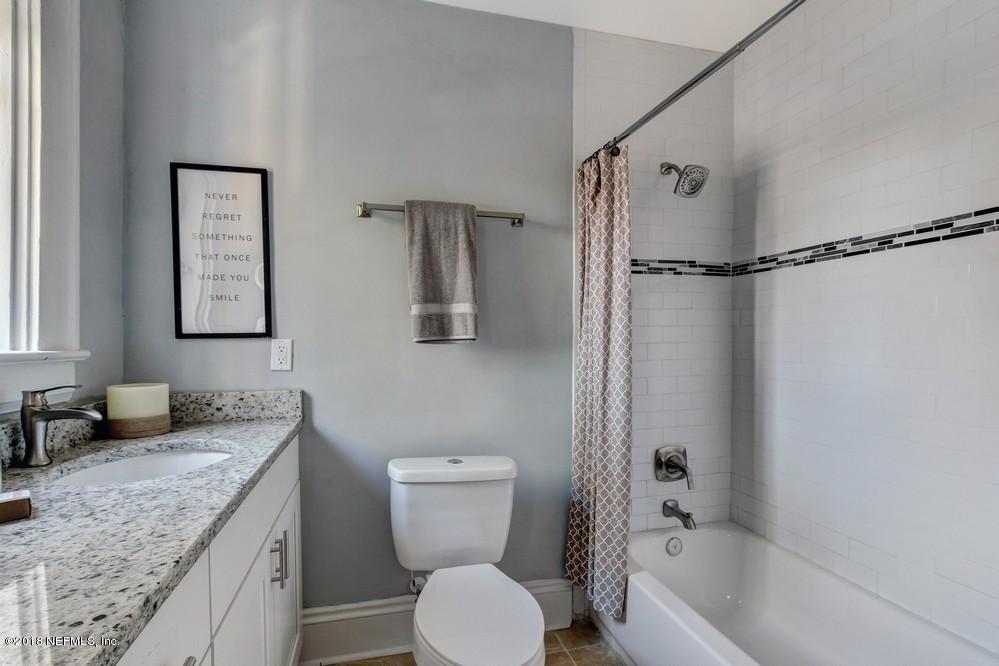 2241 Bayview Road Jacksonville, FL 32210 - Photo 47 of 55 a bathroom with a granite countertop sink toilet and shower