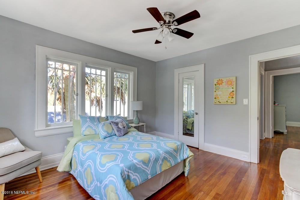 2241 Bayview Road Jacksonville, FL 32210 - Photo 49 of 55 a bedroom with a bed and wooden floor