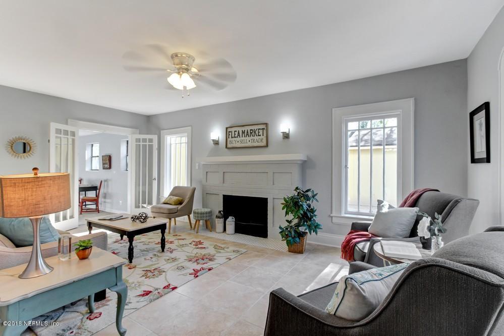 2241 Bayview Road Jacksonville, FL 32210 - Photo 7 of 55 a living room with furniture and a fireplace