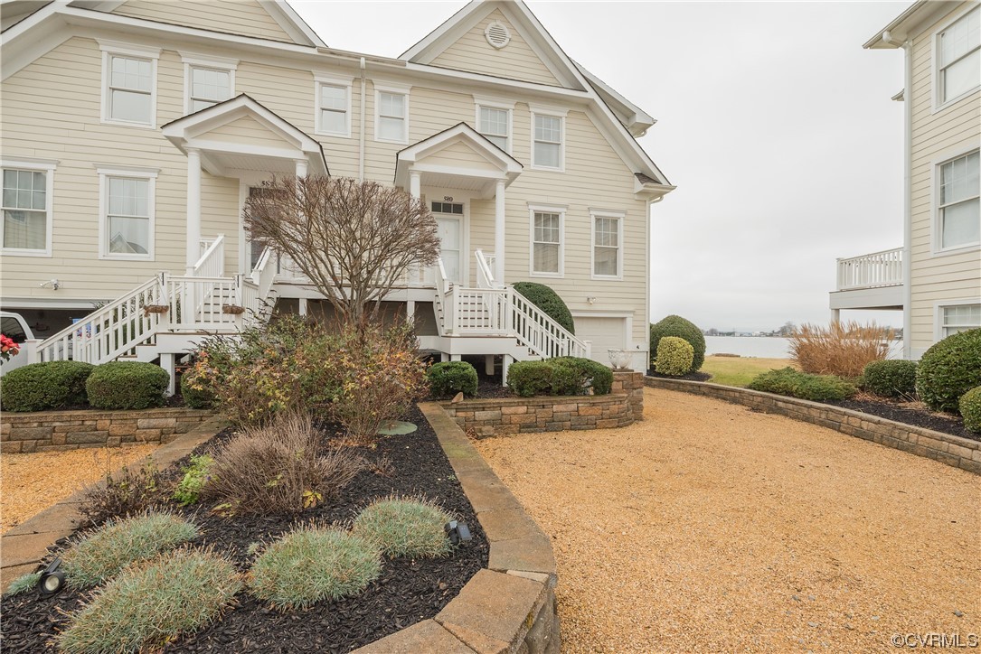 a view of a white house with a outdoor space