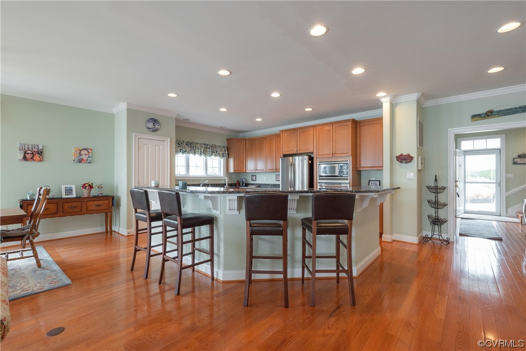 580 Riverside Drive Lancaster, VA 22503 - Photo 12 of 50 a view of a dining room with furniture and wooden floor