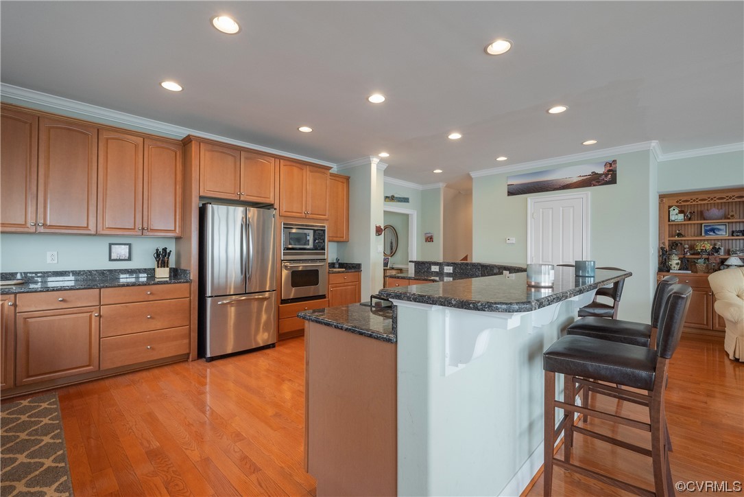580 Riverside Drive Lancaster, VA 22503 - Photo 13 of 50 a kitchen with refrigerator and chairs