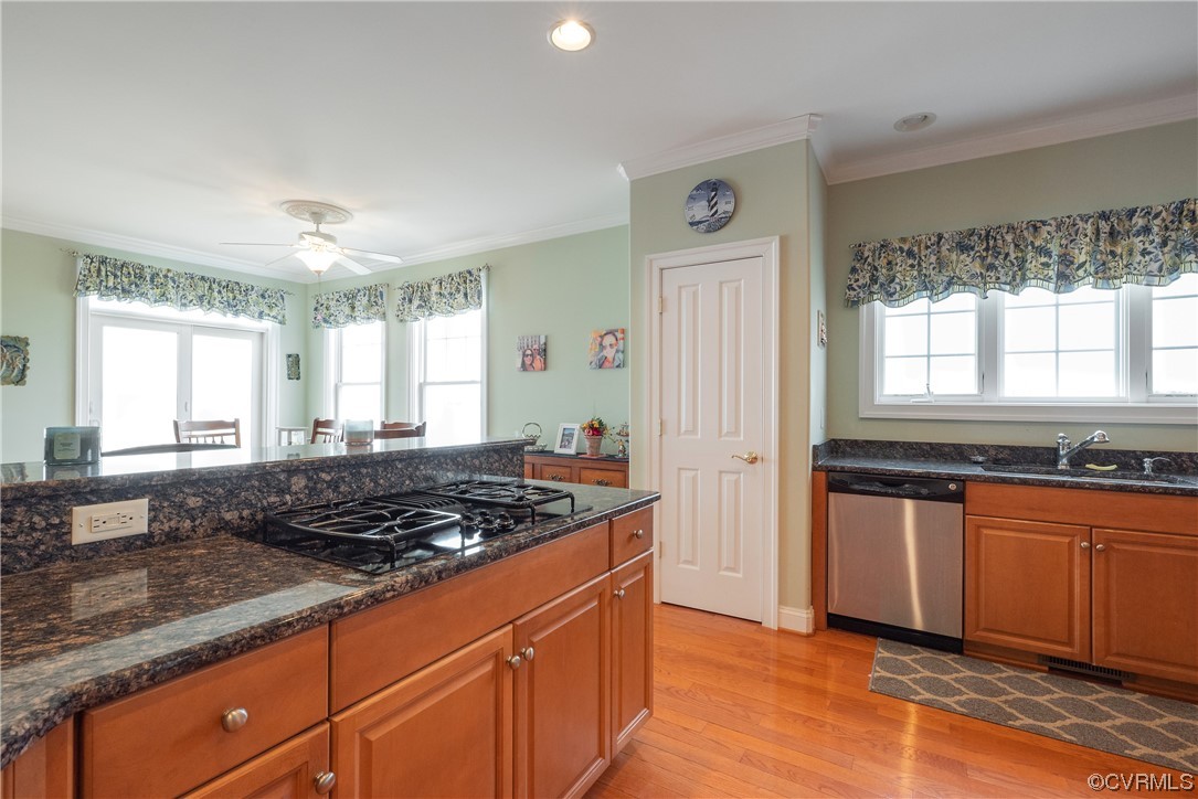 580 Riverside Drive Lancaster, VA 22503 - Photo 16 of 50 a kitchen with stainless steel appliances granite countertop a stove a sink and a microwave