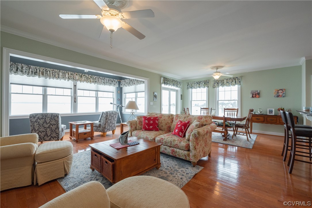 580 Riverside Drive Lancaster, VA 22503 - Photo 19 of 50 a living room with furniture and a large window
