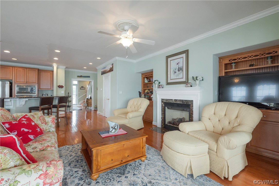 580 Riverside Drive Lancaster, VA 22503 - Photo 20 of 50 a living room with furniture and a fireplace