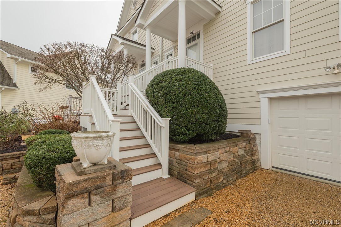 580 Riverside Drive Lancaster, VA 22503 - Photo 2 of 50 a view of a house with a large window and wooden fence
