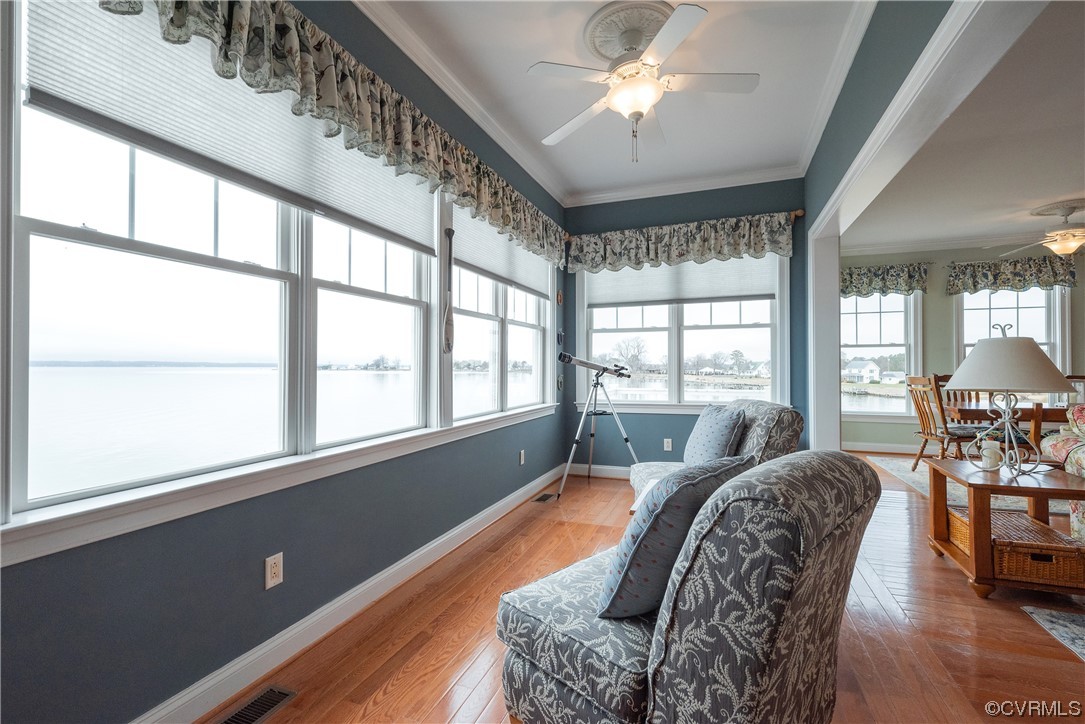580 Riverside Drive Lancaster, VA 22503 - Photo 22 of 50 a living room with furniture and large windows