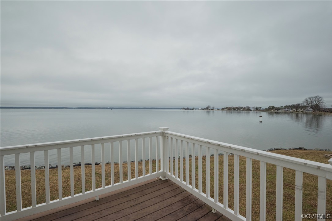 580 Riverside Drive Lancaster, VA 22503 - Photo 23 of 50 a balcony with wooden floor and lake view