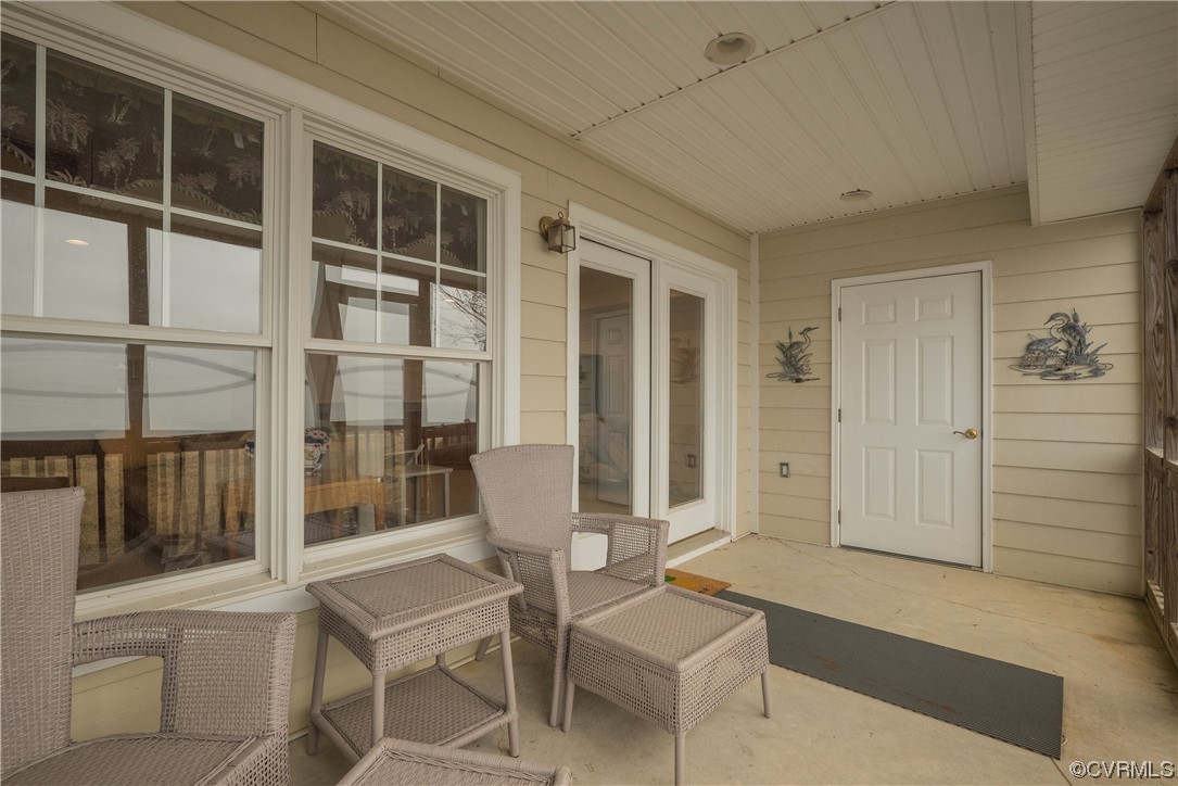 580 Riverside Drive Lancaster, VA 22503 - Photo 32 of 50 a balcony with table and chairs