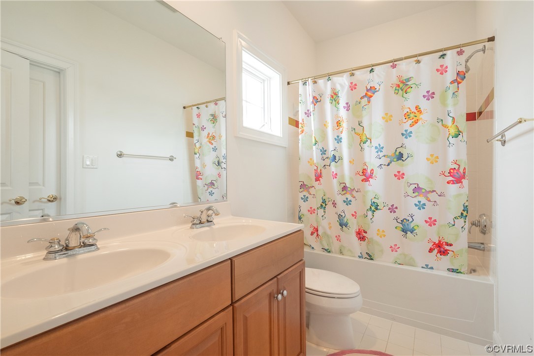 580 Riverside Drive Lancaster, VA 22503 - Photo 37 of 50 a bathroom with a sink a toilet and a shower curtain