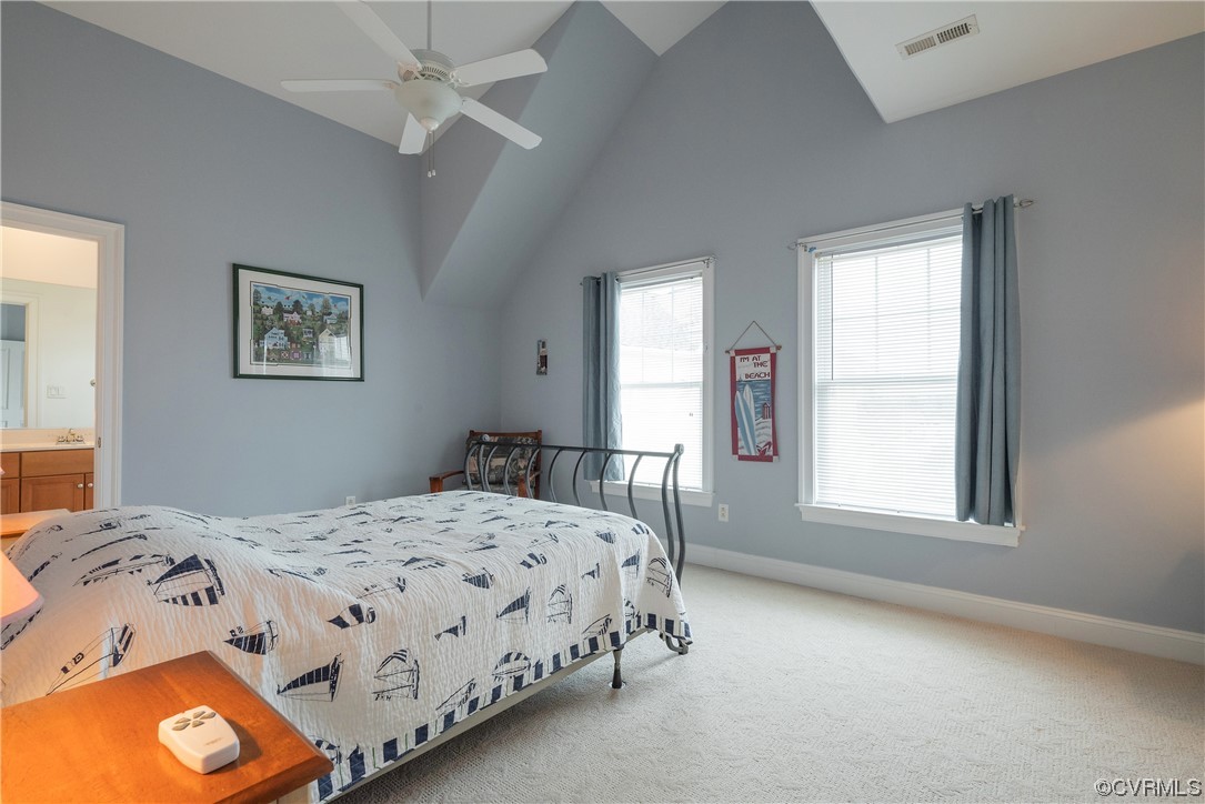 580 Riverside Drive Lancaster, VA 22503 - Photo 38 of 50 a bedroom with a bed and a window