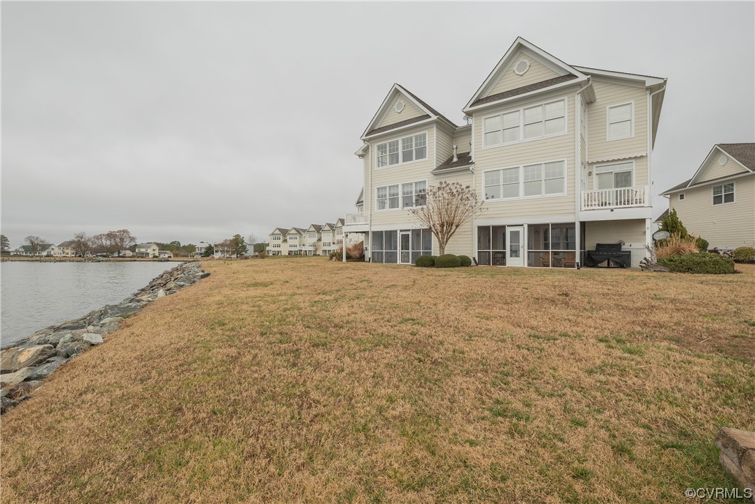 580 Riverside Drive Lancaster, VA 22503 - Photo 45 of 50 a front view of a building with lake view