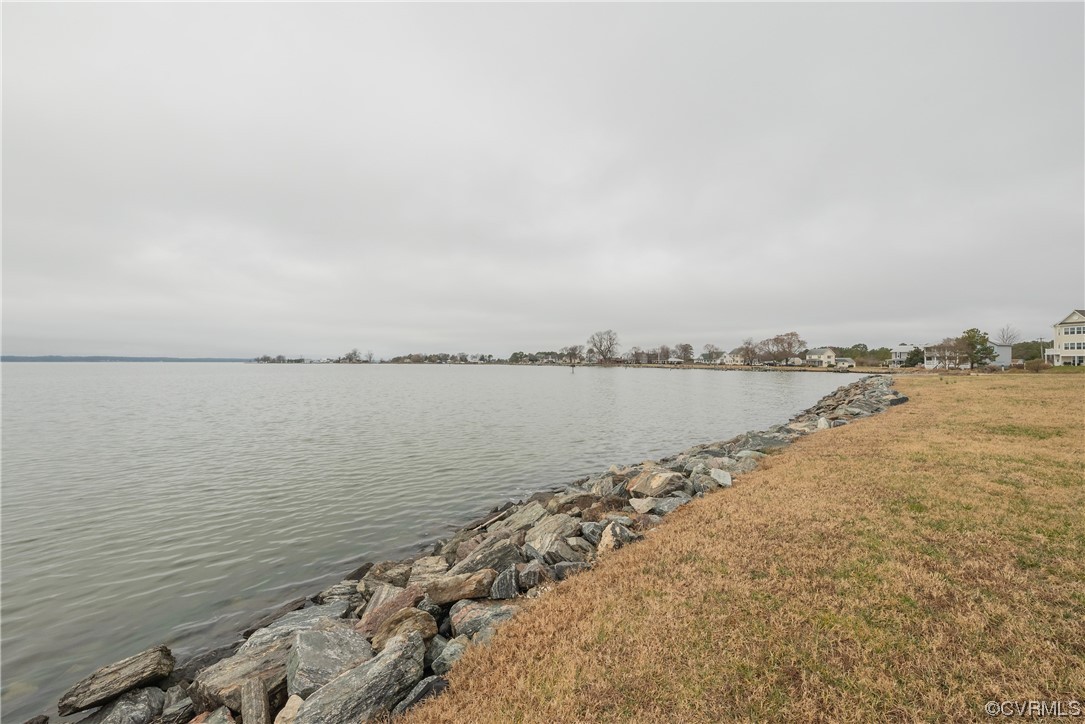 580 Riverside Drive Lancaster, VA 22503 - Photo 46 of 50 a view of a lake with a beach
