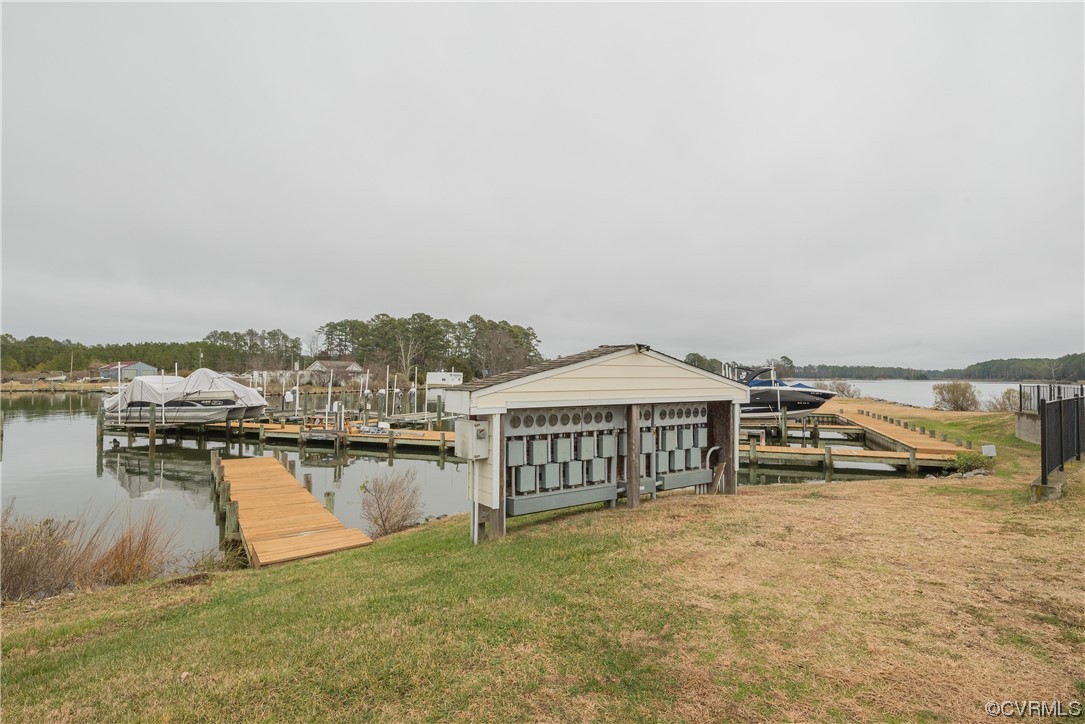580 Riverside Drive Lancaster, VA 22503 - Photo 47 of 50 a terrace with a bench and lake view