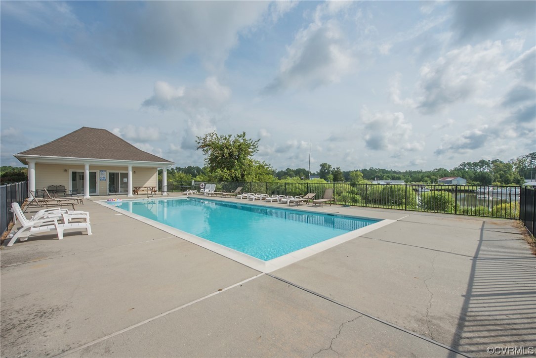 580 Riverside Drive Lancaster, VA 22503 - Photo 49 of 50 a view of house with swimming pool and yard