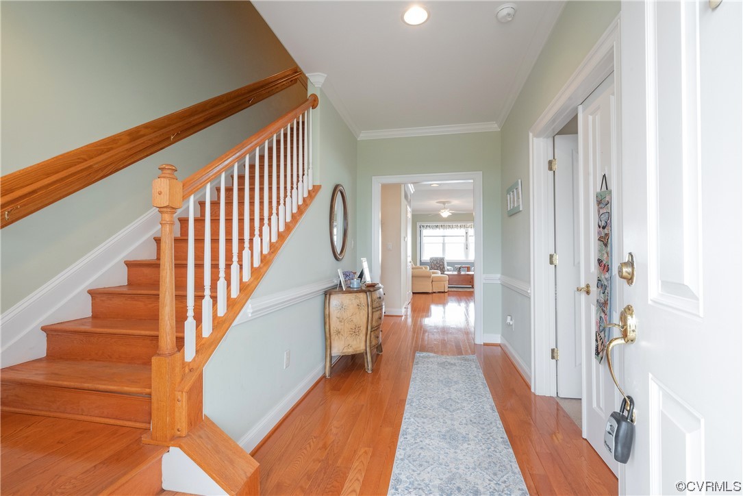 580 Riverside Drive Lancaster, VA 22503 - Photo 8 of 50 a view of a hallway with wooden floor and staircase