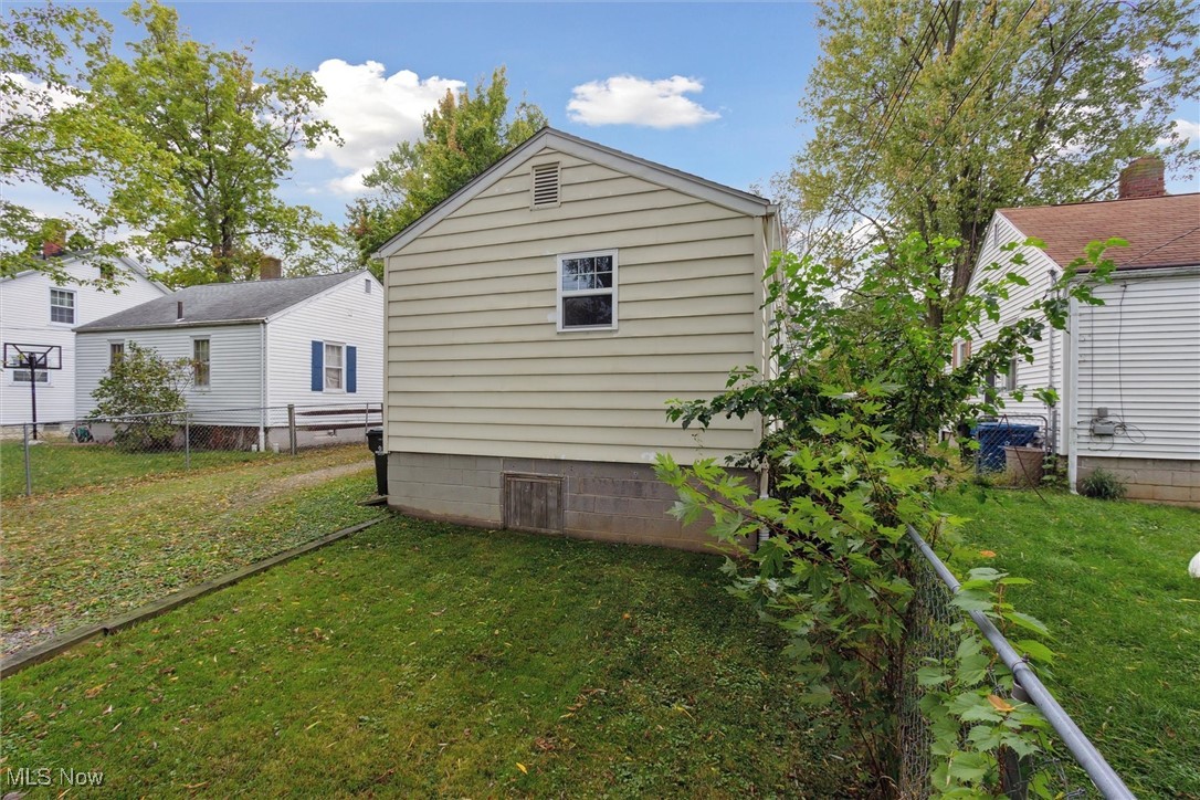 373 Erie Road Vermilion, OH 44089 - Photo 28 of 29 View of side of home featuring a yard